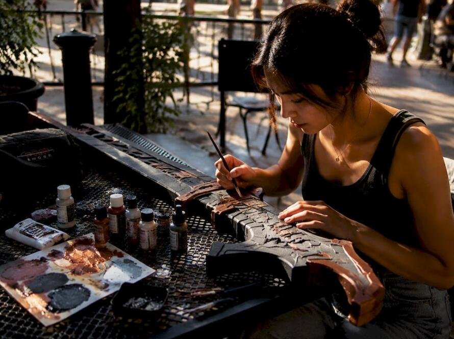 Person crafting foam cosplay weapon