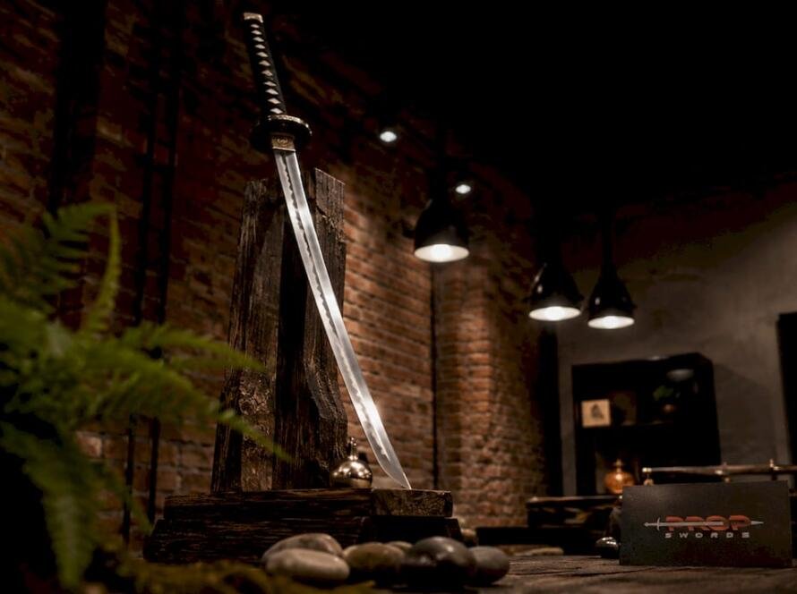 Katana replica sword displayed on velvet rest